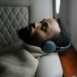 Person resting with headphones on.