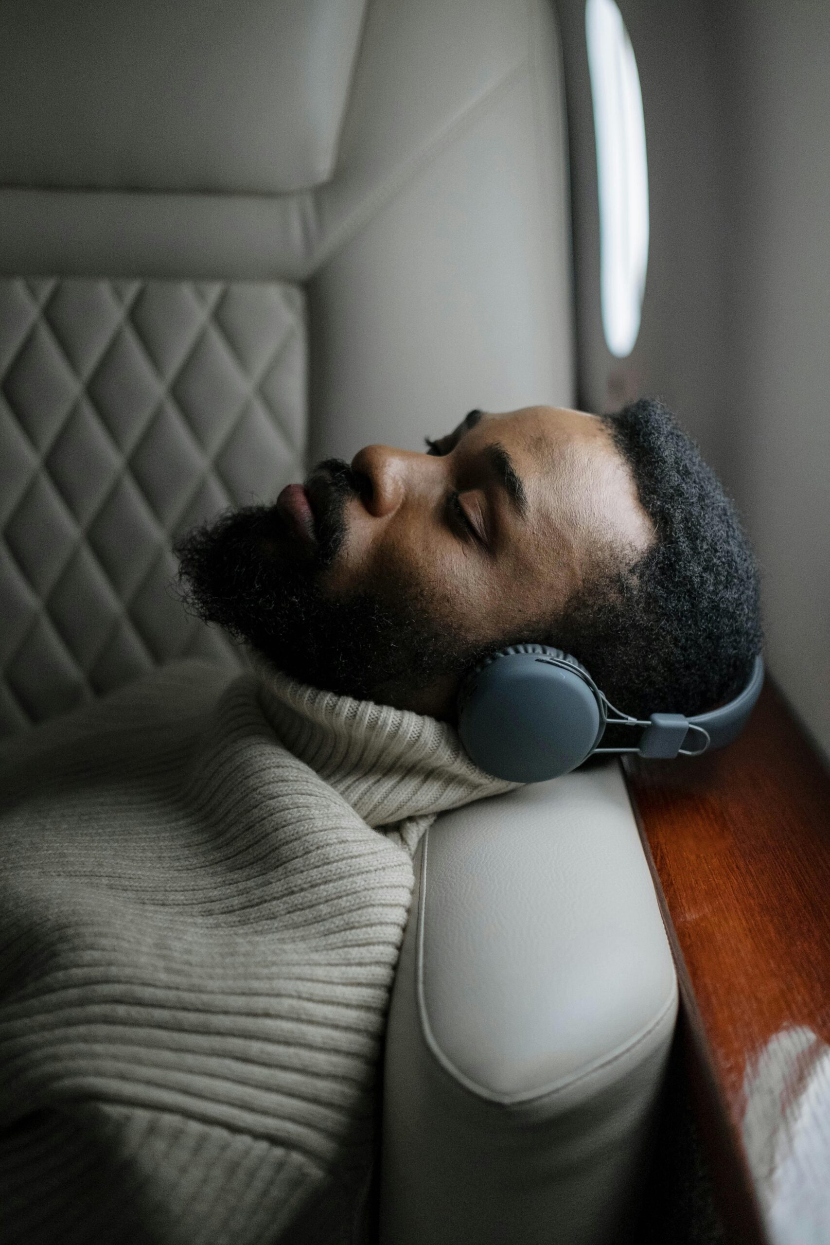 Person resting with headphones on.